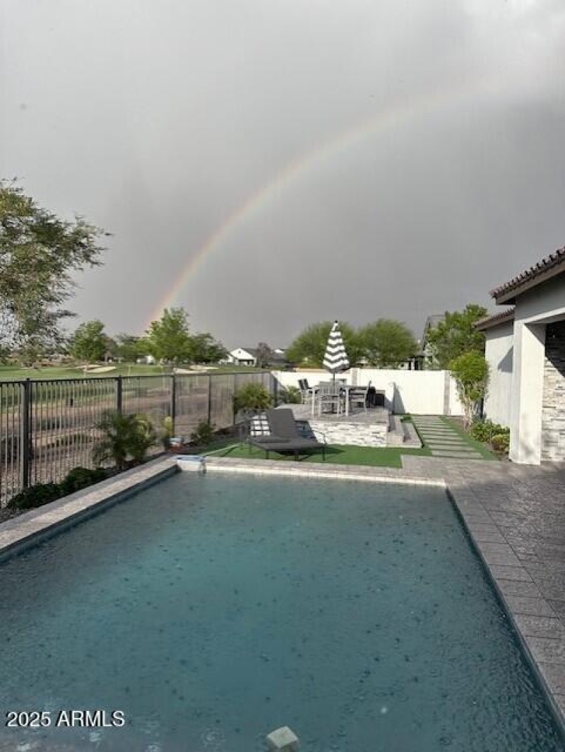 rainbow over the 10th hole from backyard