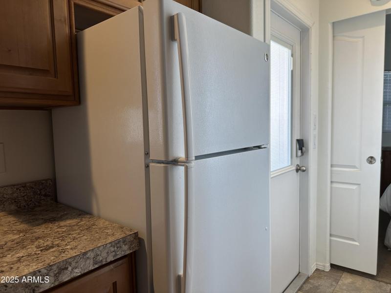 Kitchen Refrigerator is full sized