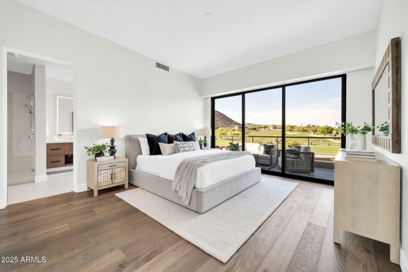 Primary bedroom with private balcony