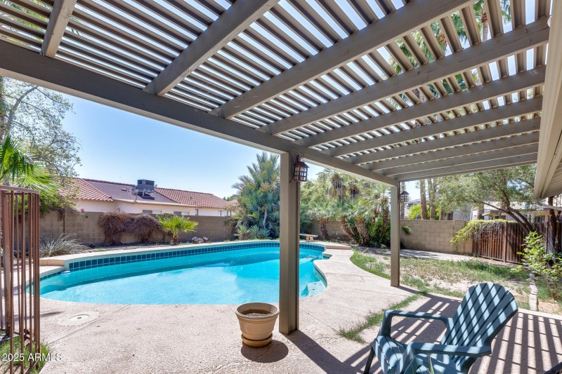 Pool with pergola covered patio