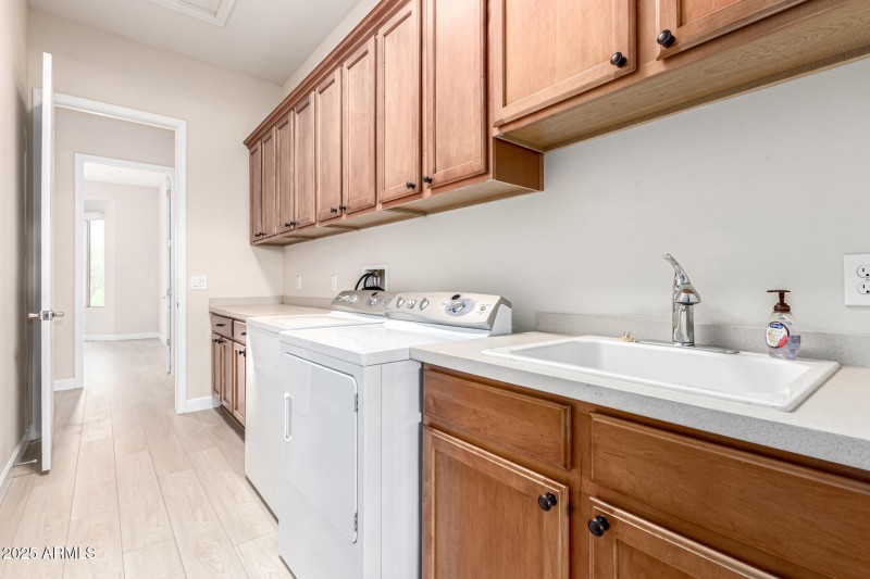 Large Laundry w sink and Cabinets