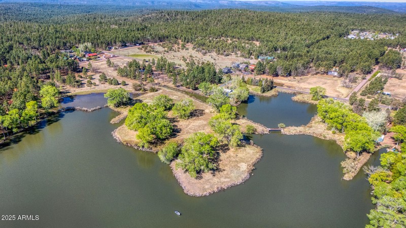 Aerial of spring-filled lake - Larson rd