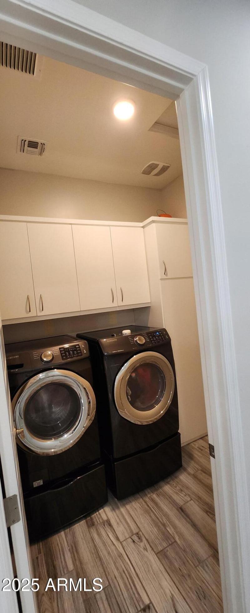 Laundry room with cabinets
