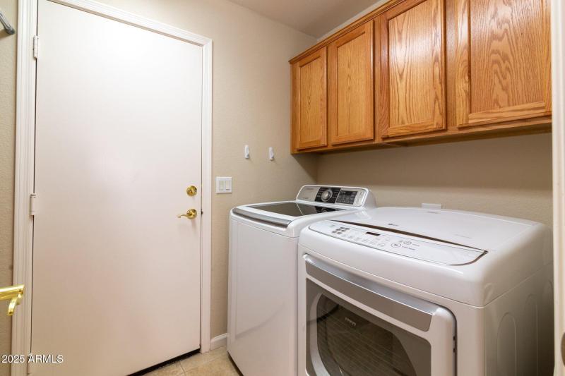 Laundry room with cabinets