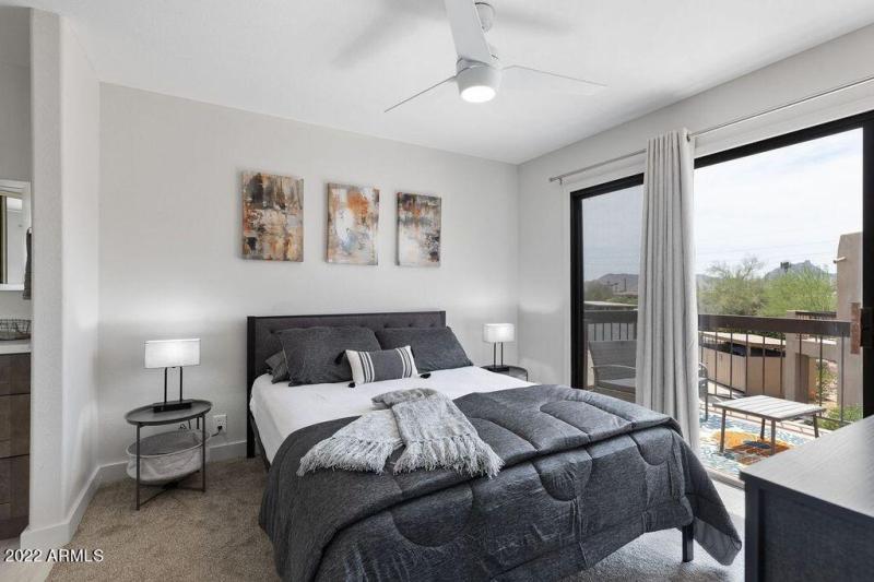bedroom opens to balcony living area