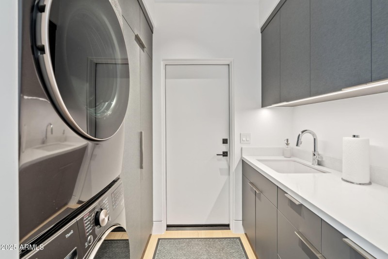 Laundry w/ Custom Tile & Cabinetry