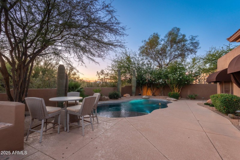 Backyard Pool View At Twilight