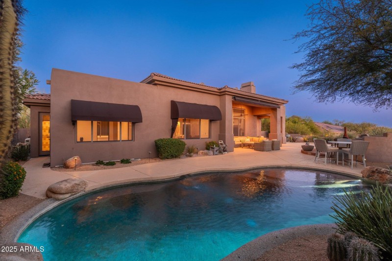 Backyard Pool View At Twilight