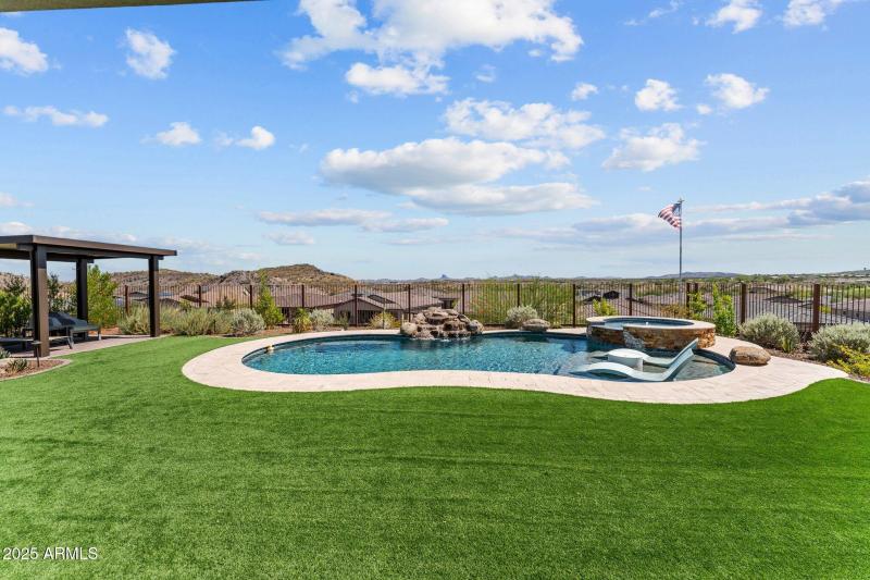 Large yard with pool and spa