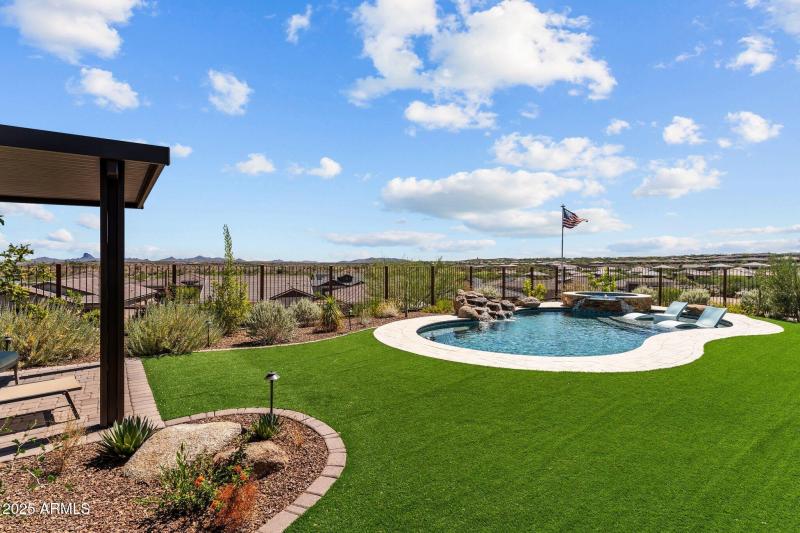 Large yard with pool and spa