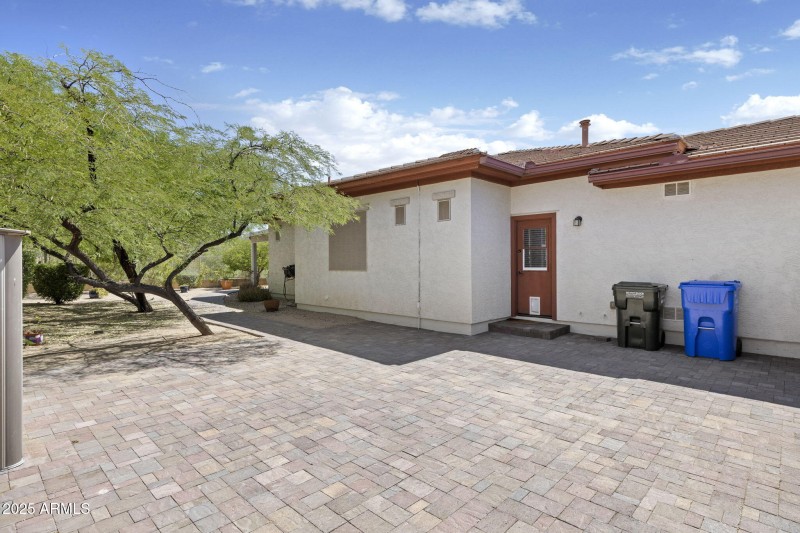 Side yard with entrance to laundry room