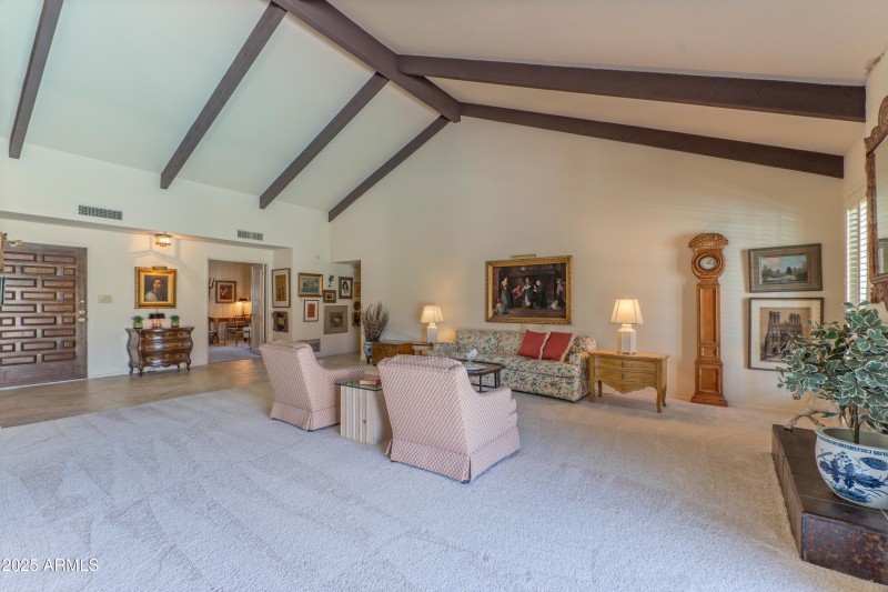 Living room with beamed ceilings
