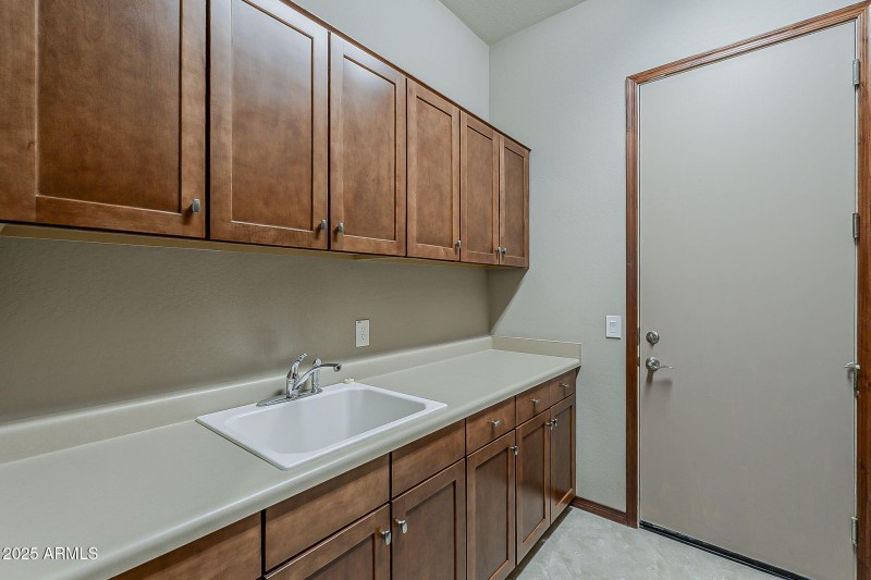 Laundry Room Sink and cabinets