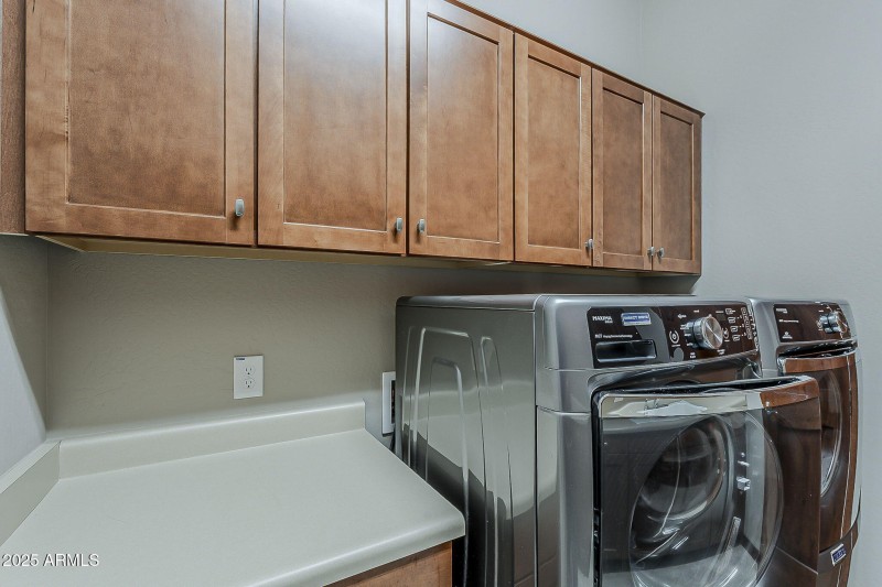 Laundry room with washer and dryer