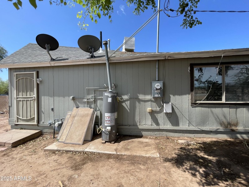 BACK DOOR AT UNIT 2 * GAS WATER HEATER