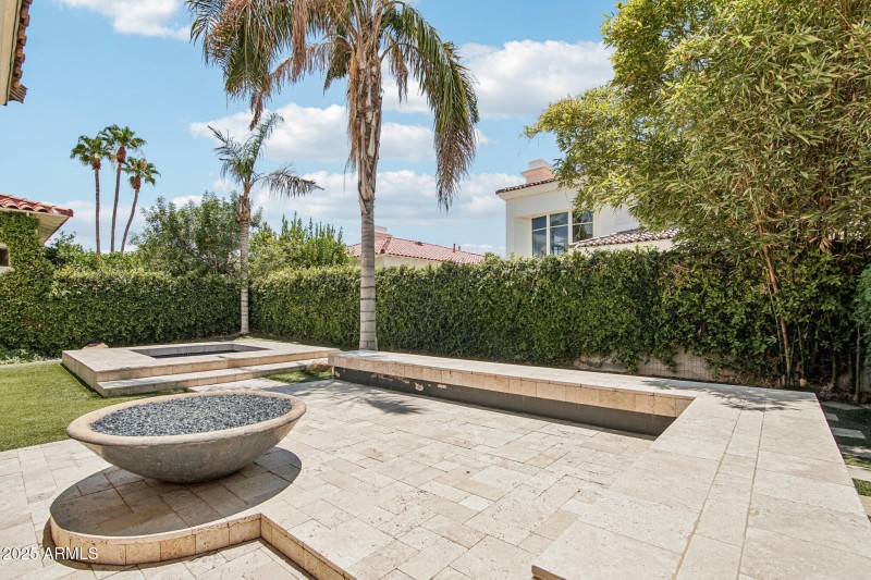 Backyard with spa and travertine decking