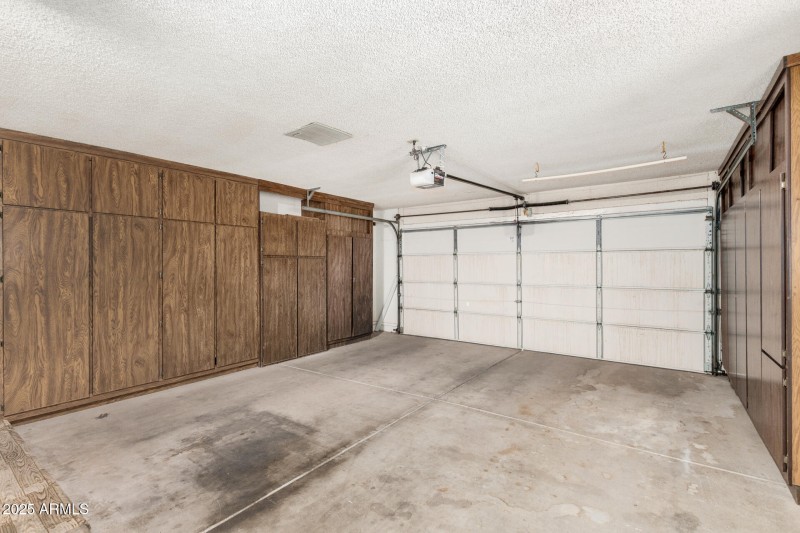 Garage with built in cabinets