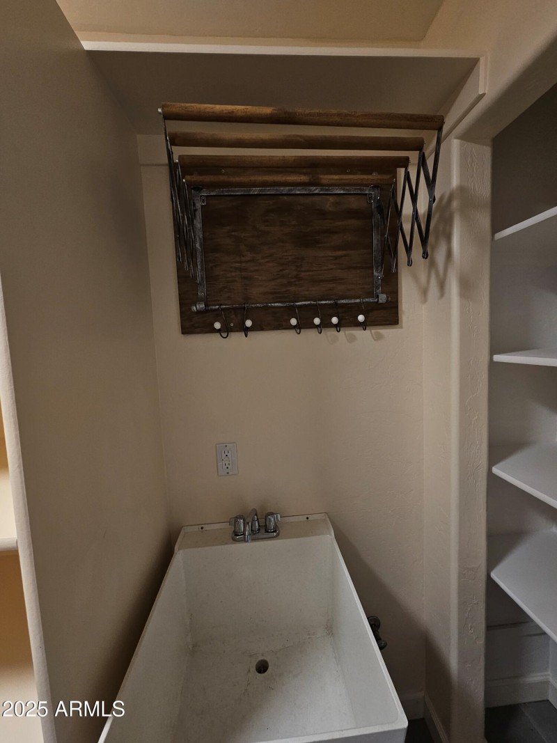 laundry room deep sink and drying rack