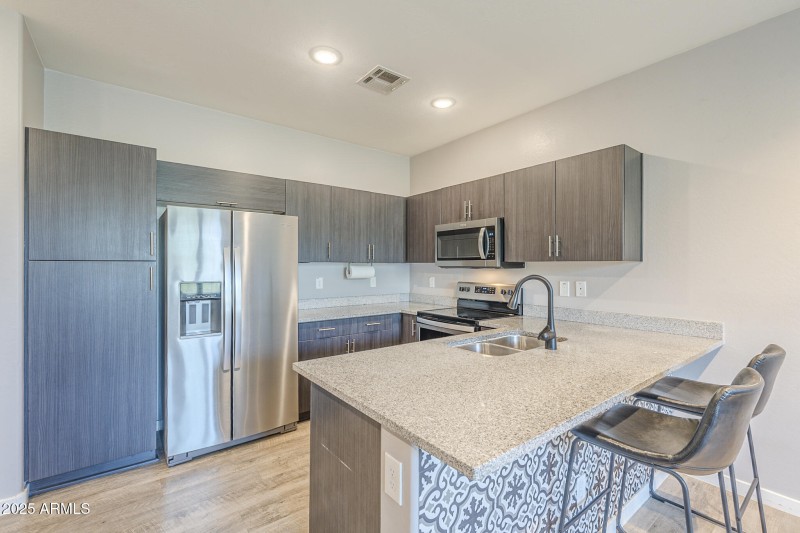 Refrigerator stays with the home!