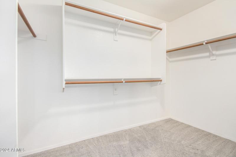 Primary walk-in closet w-shelves & mirro