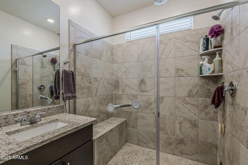 Walk-in shower with seat.