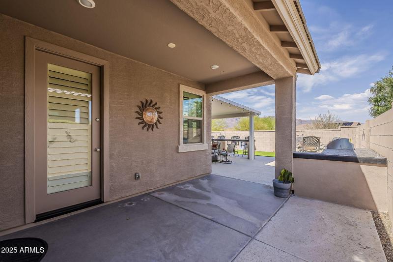 Exit to side patio and yard.