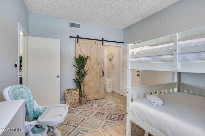 Bedroom with Barn Door Accent