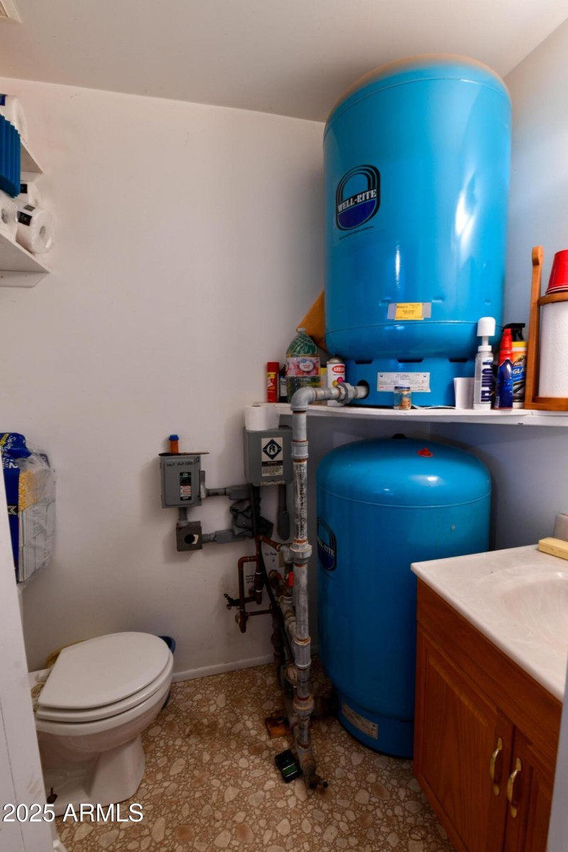 Garage half bath and well tanks
