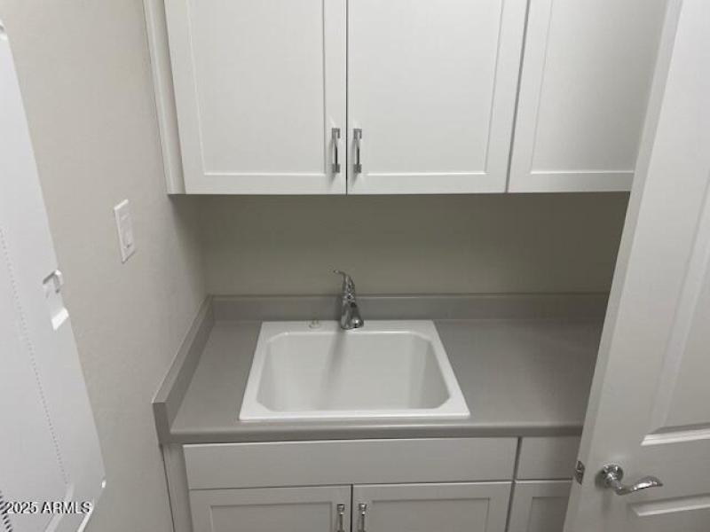 Laundry room with a sink