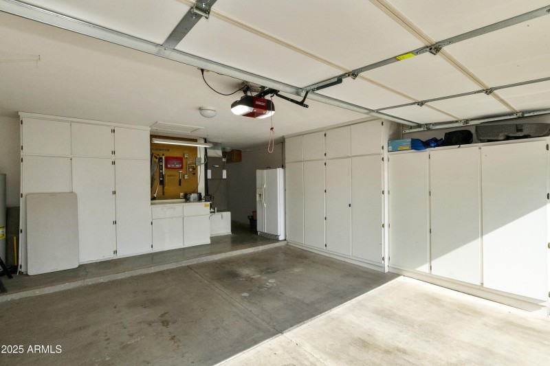 Garage with cabinets and work bench