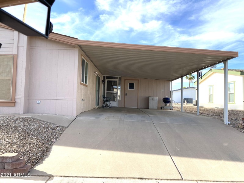 Long double driveway and carport