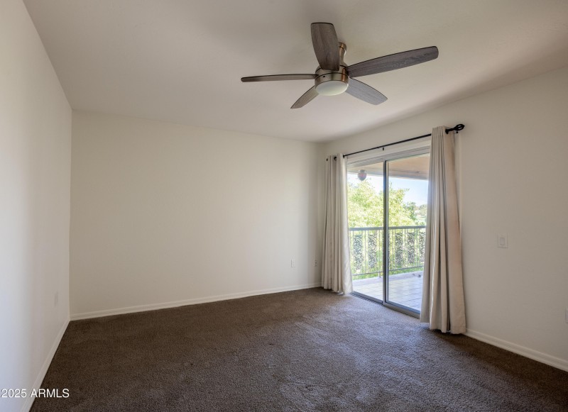 BEDROOM W/ EXIT TO BALCONY