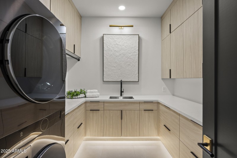Separate laundry room with extra storage