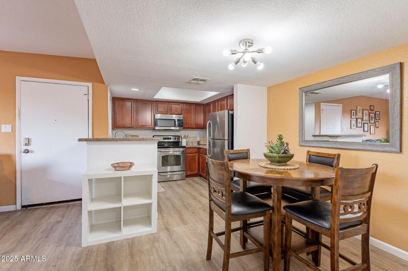 DINING, KITCHEN, AND FRONT ENTRY