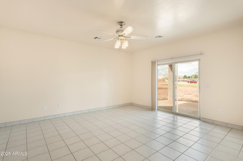 Walks out onto the covered patio