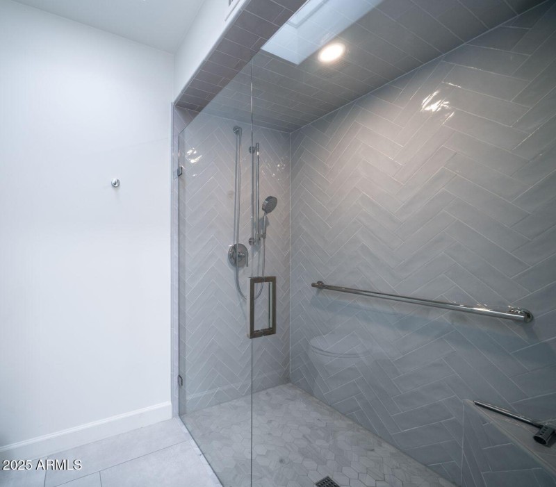 Stylish tiled shower with custom shower