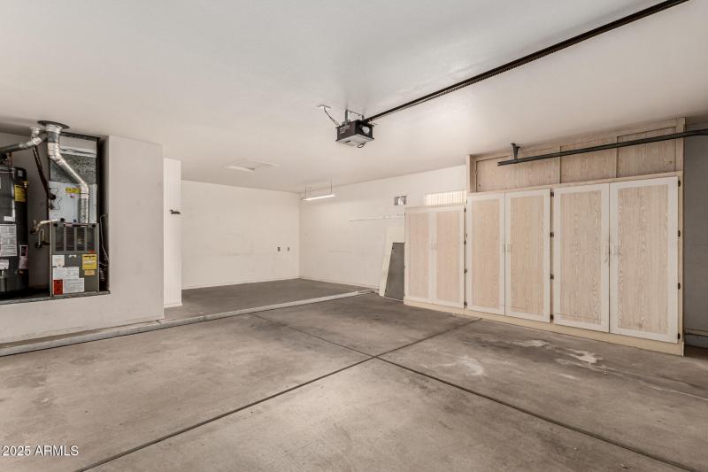 Cabinets and bonus space in the garage