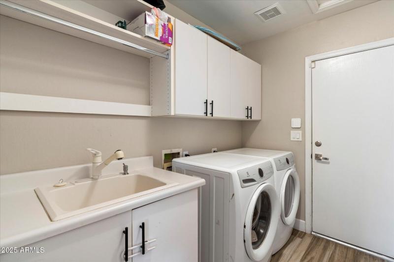 Laundry Room with Utility Sink to Garage
