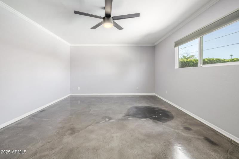 Primary Bedroom with view of backyard
