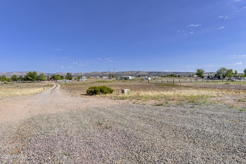Front yard fully fneced with a gate