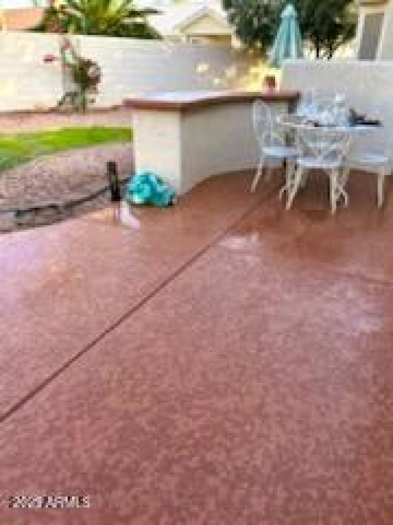 Back yard cool-dek patio and grass