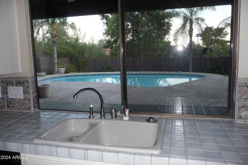 Kitchen overlooks pool