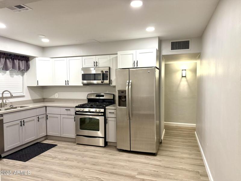 7016 kitchen and hallway to 2 bedrooms