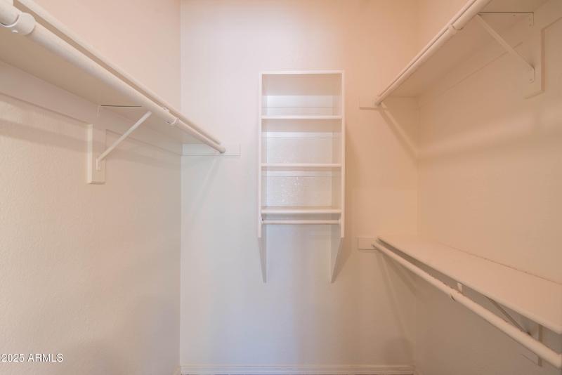 Closet in primary bedroom