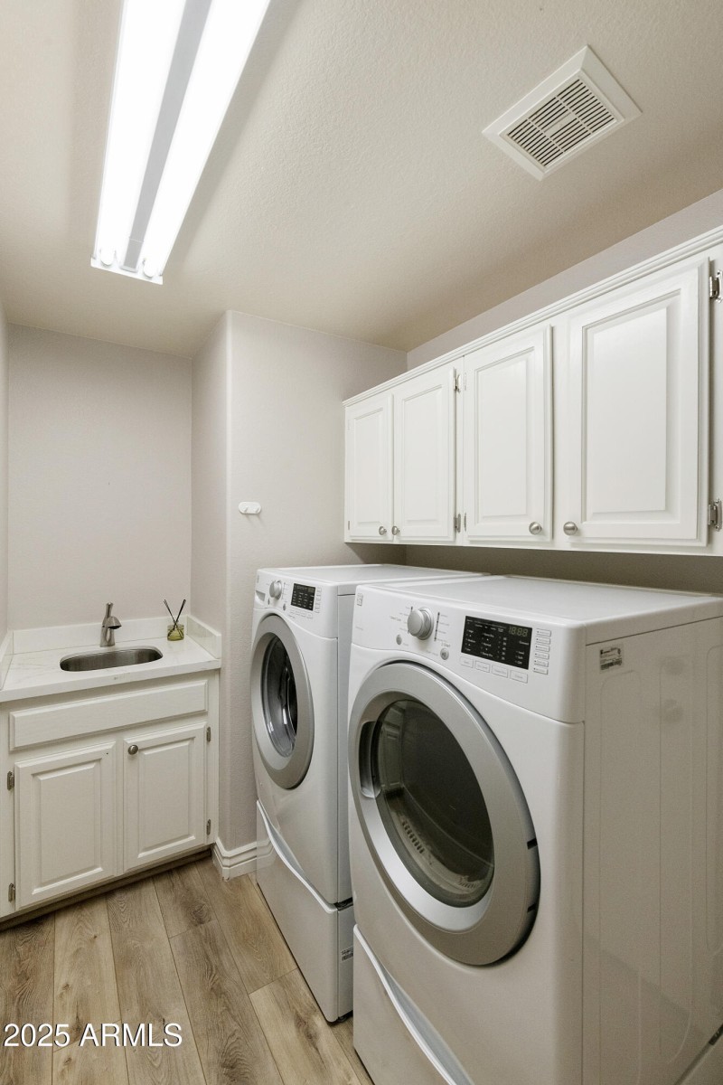 Laundry Room with cabinets/sink