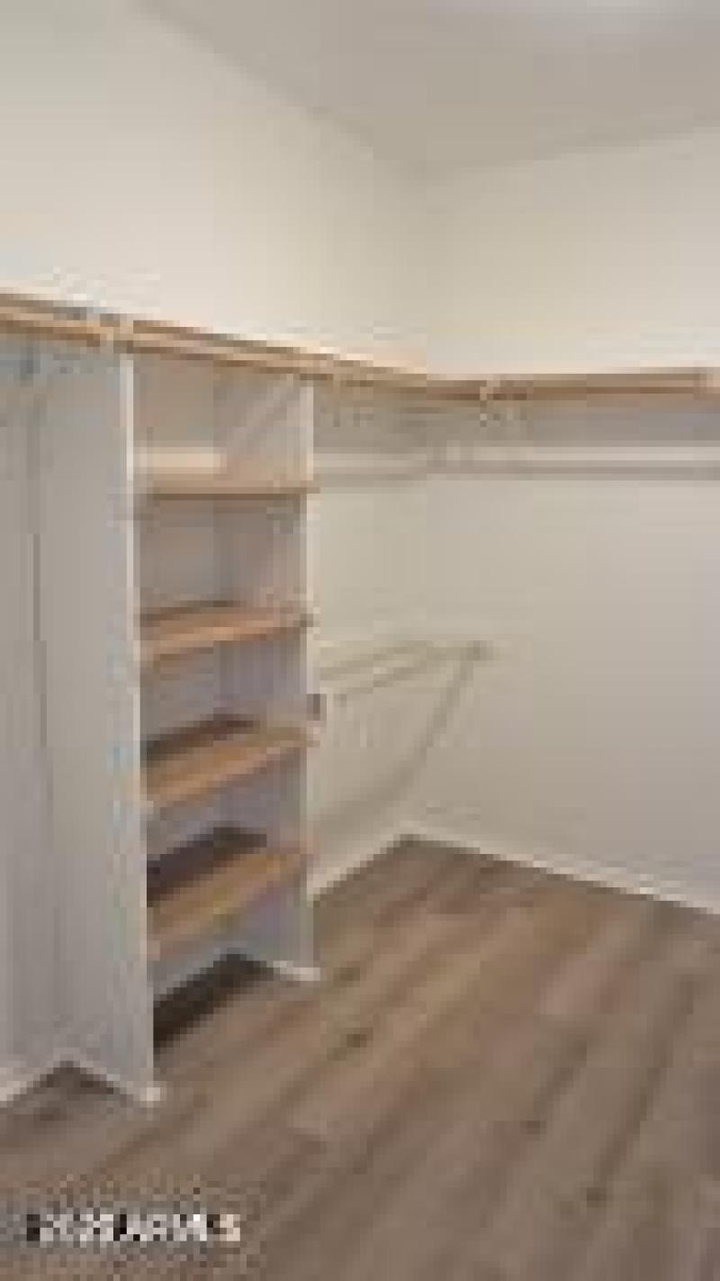 Primary Walk-In Closet 1