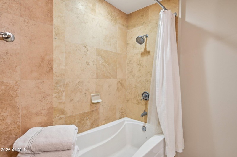 Soaking tub with tiled shower