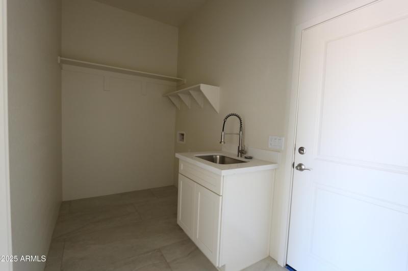 Laundry room with sink