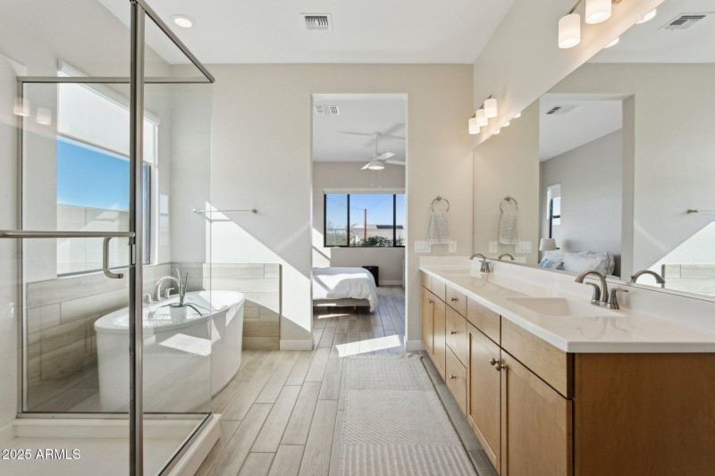 Primary soaking tub and expanded shower