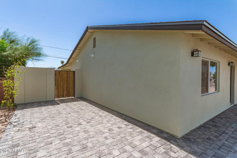 E SIDE OF HOME W/ EXTENDED DRIVEWAY